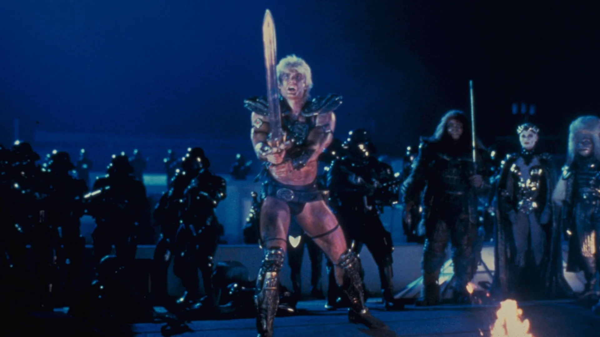 Por qué la película MASTERS OF THE UNIVERSE de 1987 se vio obligada a dejar atrás Eternia y llevar la batalla a la Tierra – GeekTyrant
